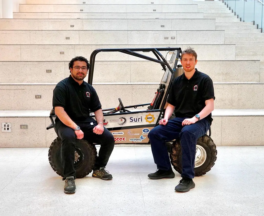 UCalgary Baja team members with the car