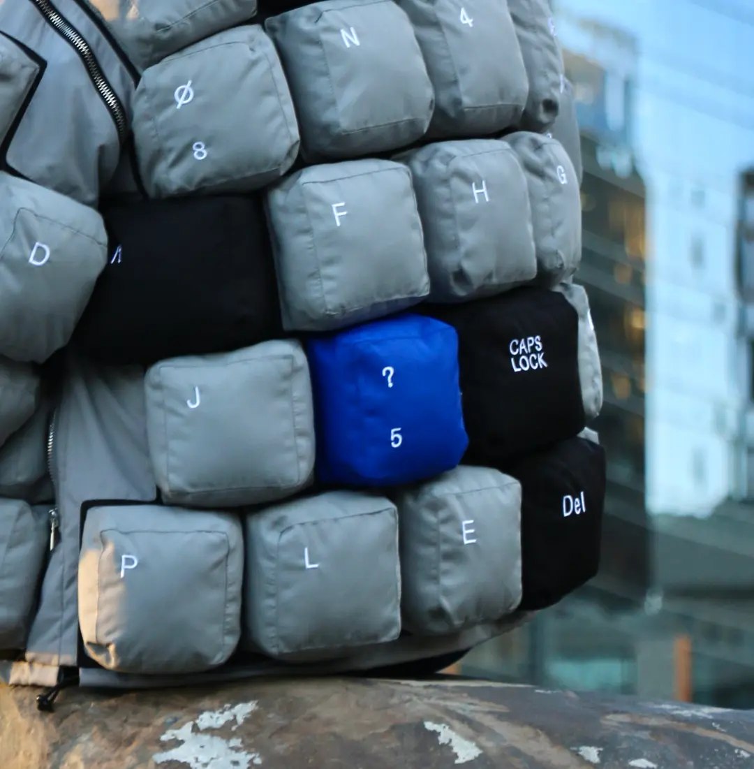 Cobalt key detail on the quilted jacket.
