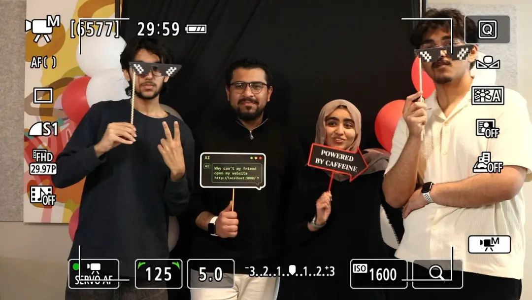 The VISR team in a photo booth at the Cursor Hackathon